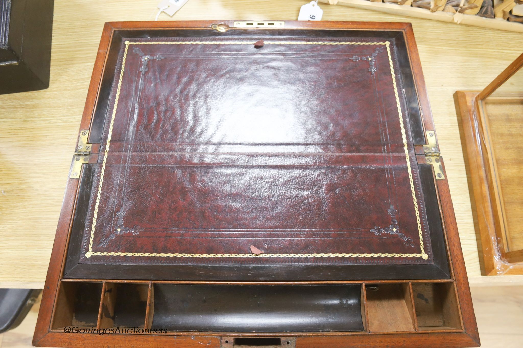 A Victorian brass bound mahogany writing slope, with burgundy leather, length 50cm